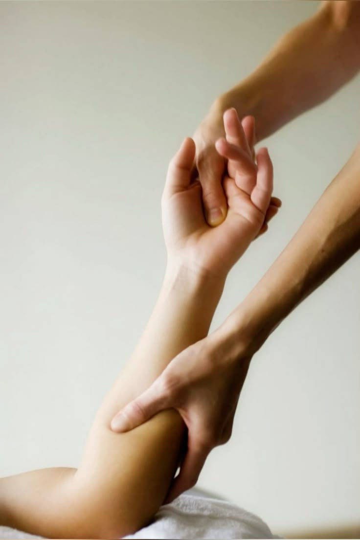 Two forearms and a lifted hand
